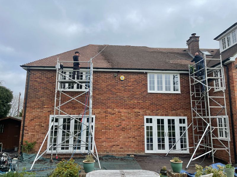 Roof cleaning carried out safely from scaffold towers by The Roof Moss Cleaners in Chalfont St Giles